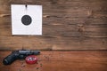 Gun and paper target. Shooting practice. Shooting range. Royalty Free Stock Photo