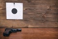 Gun and paper target. Shooting practice. Shooting range. Royalty Free Stock Photo