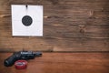 Gun and paper target. Shooting practice. Shooting range.