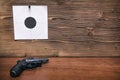 Gun and paper target. Shooting practice. Shooting range. Royalty Free Stock Photo