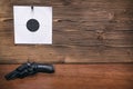Gun and paper target. Shooting practice. Shooting range. Royalty Free Stock Photo
