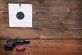 Gun and paper target. Shooting practice. Shooting range. Royalty Free Stock Photo