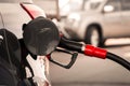 Gun petrol in tank to fill. Pumping gasoline fuel in car at gas station. Refueling automobile with diesel with dispenser Royalty Free Stock Photo