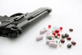 Gun or pills two options to suicide Royalty Free Stock Photo