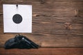 Gun and paper target. Shooting practice. Shooting range. Royalty Free Stock Photo