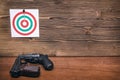 Gun and paper target. Shooting practice. Shooting range. Royalty Free Stock Photo