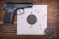 Gun and paper target. Shooting practice. Shooting range. Royalty Free Stock Photo