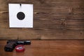 Gun and paper target. Shooting practice. Shooting range. Royalty Free Stock Photo