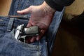 Gun in woman Jeans pocket, dangerous for many reasons
