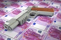 Banknotes 500 euros gun trafficking dirty money full frame concept