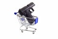 Gun in a shopping cart Royalty Free Stock Photo