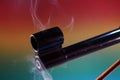 Gun with smoking barrel recorded in the studio Royalty Free Stock Photo