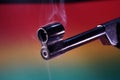Gun with smoking barrel recorded in the studio Royalty Free Stock Photo