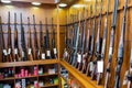 Gun store interior with rifles on showcase Royalty Free Stock Photo