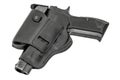 The gun in a tactical leather holster. Isolated