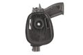 The gun in a tactical leather holster. Isolated