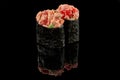 Gunkan maki sushi with eel and avocado on black background