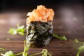 Gunkan Maki Sushi with Seafood, caviar and Spicy Sauce. Delicious Gunkan Sushi on wooden table. Royalty Free Stock Photo