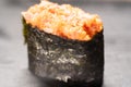 Gunkan Maki Sushi with Seafood, caviar and Spicy Sauce. Spicy gunkan with tuna isolated on black. Delicious Gunkan Sushi Royalty Free Stock Photo