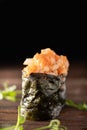 Gunkan Maki Sushi with Seafood and Spicy Sauce. Delicious Gunkan Sushi on wooden table. Isolated Royalty Free Stock Photo