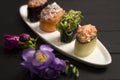 Gunkan Sushi restaurant menu close up of chuka wakame seaweed in focus. food on white plate with flowers on background Royalty Free Stock Photo