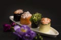 Gunkan Sushi restaurant menu close up of Sake salmon in focus. food on white plate with flowers on background Royalty Free Stock Photo