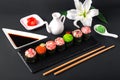 Gunkan sushi set with salmon, tuna, perch, eel, scallop, caviar, shrimp, sharp. Traditional Japanese cuisine. Royalty Free Stock Photo