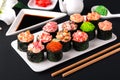 Gunkan sushi set with salmon, tuna, perch, eel, scallop, caviar, shrimp, sharp. Traditional Japanese cuisine. Royalty Free Stock Photo