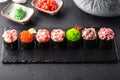 Gunkan sushi set with salmon, tuna, perch, eel, scallop, caviar, shrimp, sharp. Traditional Japanese cuisine. Royalty Free Stock Photo