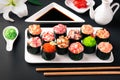 Gunkan sushi set with salmon, tuna, perch, eel, scallop, caviar, shrimp, sharp. Traditional Japanese cuisine. Royalty Free Stock Photo