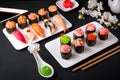 Gunkan sushi set with salmon, tuna, perch, eel, scallop, caviar, shrimp, sharp. Traditional Japanese cuisine. Royalty Free Stock Photo