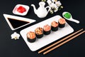 Gunkan sushi set with salmon, tuna, perch, eel, scallop, caviar, shrimp, sharp. Traditional Japanese cuisine. Royalty Free Stock Photo