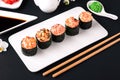 Gunkan sushi set with salmon, tuna, perch, eel, scallop, caviar, shrimp, sharp. Traditional Japanese cuisine. Royalty Free Stock Photo