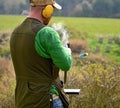 Gunman with the smoking shotgun after a shot