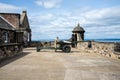 A gunner is servicing One O`Clock gun in Edinburgh Castle