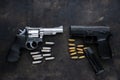 Guns and ammunition on dark background