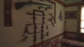 Guns hanging on the wall of the house in the Middle East