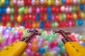 Guns pointedat rows of colorful balloons at shooting range