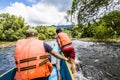 Gunung Mulu, Sarawak, Borneo- JANUAR 2019: Tourists riding long boat on Merlinau river to Wind and Clear Water caves at Mulu