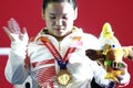 Guo Lingling of China celebrates her new world record and gold medal in Asian Para Games 2018 Royalty Free Stock Photo