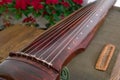 Guqin, a seven-stringed plucked instrument in some