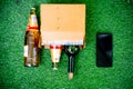 Alcohol in a cardboard box with beer and wine home delivered through online app shot in a garden at home