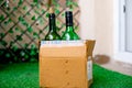 Alcohol in a cardboard box with beer and wine home delivered through online app shot in a garden at home