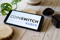 indian startup blockchain bitcoin altcoin app coinswitch kuber on a mobile phone on a wooden table showing this easy