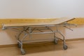 Gurney bed or wheeled stretcher for transporting bedridden patients in the hospital corridor