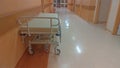 Gurney or wheeled stretcher at hospital corridor. long corridor in hospital with surgical transport