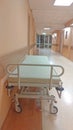 Gurney or wheeled stretcher at hospital corridor. long corridor in hospital with surgical transport