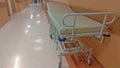 Gurney or wheeled stretcher at hospital corridor. long corridor in hospital with surgical transport