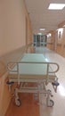 Gurney or wheeled stretcher at hospital corridor. long corridor in hospital with surgical transport