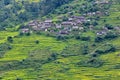 Gurung village between rice fields in the Himalayas, Nepal Royalty Free Stock Photo